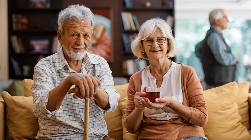 Older couple relaxing together in a living room